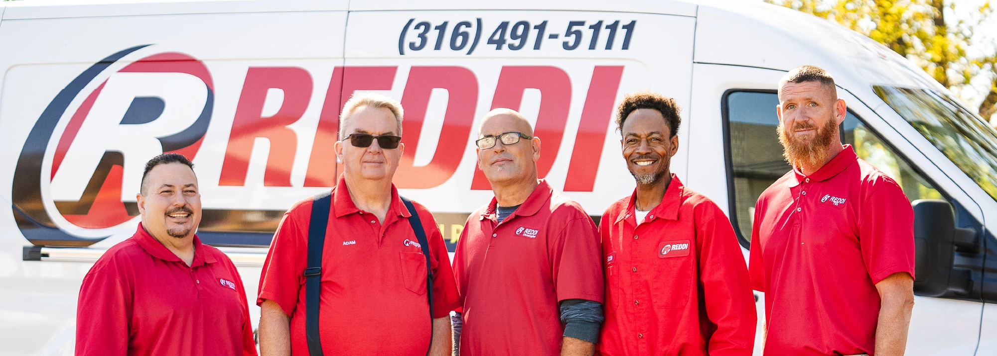 Five Men in Reddi Uniforms in front of Plumbing Truck