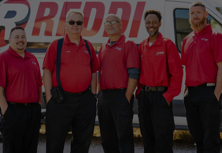 Five Men in Reddi Uniforms in front of Plumbing Truck